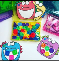 two plastic containers filled with lots of colorful buttons and magnets next to each other