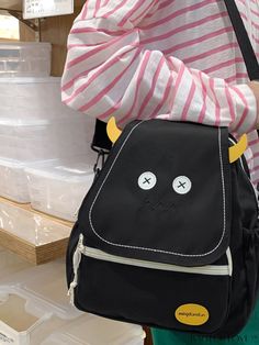 BagForLove - Cute Cartoon Backpack - Medium Size, Ideal for Students of All Grades, Perfect for School and Outdoor Activities Product Description Color Black Strap Type Adjustable Composition 100% Nylon Pattern Type Cartoon Bag Size Medium Material Polyamide Style Preppy Type Flap Backpack Closure Type Flap Size Chart INCH CM Handle Height Strap Length Bag Height Bag Width Bag Length 2 inch 35 inch 11.8 inch 4.3 inch 11.4 inch Handle Height Strap Length Bag Height Bag Width Bag Length 5 cm 89 cm Cute Black Portable Bag, Cute Portable Black Bag, Cute Black Satchel Backpack, Black Satchel Backpack Cute Style, Black School Bags For Back To School, Cute Black Backpack For Back To School, Black Portable Bag For Back To School, Cute Black Backpack With Adjustable Strap, Black Bags For Students, Back To School