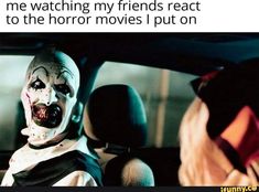 a creepy clown sitting in the driver's seat of a car with his mouth open