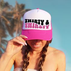 Whether you're lounging poolside, hitting the beach, or simply sipping on your favorite cocktail, these "Thirty & Thirtsy" trucker hats add an extra layer of flair to your beach birthday festivities. They're the perfect accessory for capturing unforgettable memories and creating Instagram-worthy moments! ♥ Product details: .: Sold separately .: Material: 100% polyester foam front with 100% nylon mesh weave back .: One size fits most (22.8"/58cm) .: Adjustable snap closure ♥ Shipping: A tracking Fun Summer Birthday Hat, Trendy Summer Birthday Hat, Pink Summer Birthday Hat, Fun Summer Party Trucker Hat, Summer Hats For Bachelorette Party, Fun Pink Trucker Hat For Birthday, White Summer Party Trucker Hat, Pink Novelty Trucker Hat For Beach, Pink Novelty Trucker Hat For The Beach