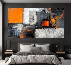 a large painting on the wall above a bed in a room with black walls and white flooring