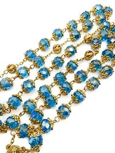 Light Blue Crystal Beads Rosary Handcrafted St. Benedict Rosary with blue crystallized glass beads with Miraculous medal and silver 1.6" Cross. Strong and elegant Rosary made of zinc alloy plated in gold for enhanced durability and corrosion resistance. ensures sturdiness while adding a touch of elegance to the design. Five decades rosary connected to devout 59 beads perfectly designed to hold on during daily usage. wearable for most people, easy to carry in your pocket, bag, or keep in your car Blue Beaded Chain Jewelry, Blue Metal Jewelry With Faceted Beads, Blue Beaded Round Jewelry, Blue Beaded Metal Jewelry, Blue Jewelry With Gold Beads For Party, Blue Faceted Beads Round Jewelry, Faceted Blue Beads For Gift, Faceted Blue Beads For Gifts, Blue Faceted Round Bead Jewelry