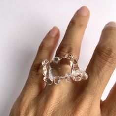 "Welcome to Hidden Glass Atelier! Glad you have found me  ✦ DESIGN    ✧ Simple and elegant band with waves like deco, handmade with clear transparent Murano glass.    ✧ Two styles: chunky and dainty to choose from    ✧ Styling: It is chic to wear alone, or stack with other metal rings for an interesting mix of material look and a pop of color. It is easy to wear up or down with a casual outfit or for a special occasion.  There is a similar style of earrings you could find it here: https://hiddenglassatelier.etsy.com/listing/1598972468    ✧ Durability: All the glass jewelry pieces are tempered by a professional kiln to provide maximum durability.    ✧ Origin: This one-of-a-kind glass ring will be custom handmade for you by me from Murano Venice Italy - the very heart of glass art since the Adjustable Clear Rings, Modern Clear Round Jewelry, Unique Resin Crystal Ring Gift, Handmade Clear Jewelry For Party, Unique Clear Crystal Ring For Gift, Unique Clear Crystal Ring As A Gift, Unique Clear Resin Ring, Unique Clear Resin Rings, Modern Adjustable Crystal Ring For Gifts