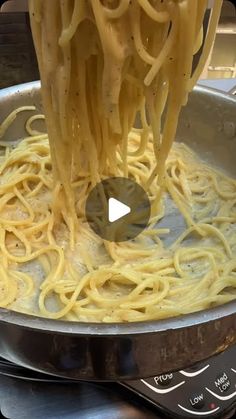 the pasta is being cooked on the stove