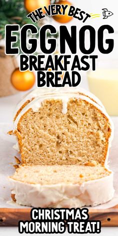 an eggnog breakfast bread on a cutting board with oranges in the background