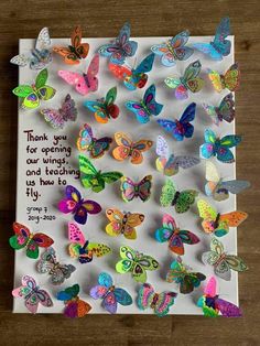 a bunch of colorful butterflies on top of a white paper with the words thank you for opening our wings and giving us how to fly