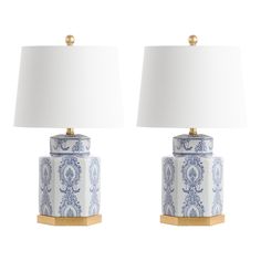 two blue and white ceramic lamps with gold bases