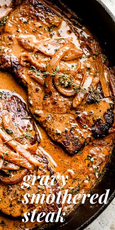 steak with gravy and mushrooms in a skillet