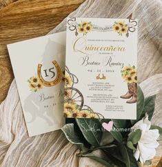 two sunflowers and cowboy boots are on top of the wedding stationery cards