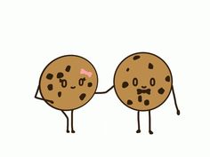 two chocolate chip cookies holding hands with pink bow