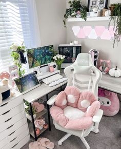 a white desk topped with a pink chair next to a computer monitor and mouse pad