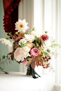 a bouquet of flowers sitting on top of a table