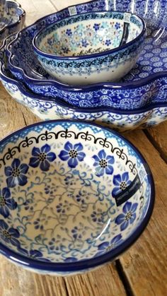 blue and white dishes on a wooden table