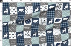 a blue and gray plaid fabric with white animals on it, including the words little man