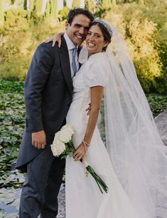 a bride and groom posing for a photo