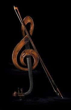 a musical instrument with a treble in the shape of a music note on a black background