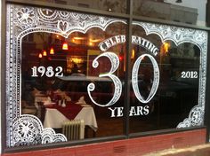 the window of a restaurant that has been decorated for 30 years