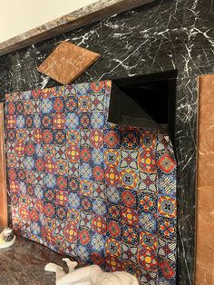 an artisticly designed bathroom with marble walls