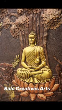 a golden buddha statue sitting on top of a tree