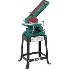 a table sawing machine sitting on top of a stand