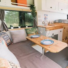 a kitchen and dining area in an rv