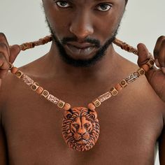 The African Lion never loses. With this men's necklace pendant, you will become a king. Strong, sensitive, and loving nature only with a lion trolog necklace.INDIVIDUAL AND PERSONALIZED ORDERS.Do not hesitate to contact us if you would like to add, remove, or change the color of any part of the necklace.ATTENTION PLEASE!If the item is damaged during shipping, please provide the photo to us within 1 day of receipt, and we will resend you a new item or refund.PAY ATTENTION TO THE FAQ SECTION: Care Men Pendant, Mens Necklace Pendant, Astrology Necklace, Lion Necklace, Mask Necklace, African Lion, African Necklace, Leo Men, Art Deco Necklace