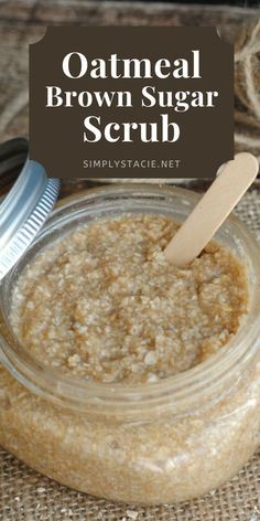 oatmeal brown sugar scrub in a glass jar with a wooden spoon next to it