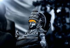 a statue is shown in black and white with an orange circle on it's forehead