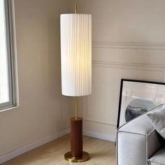 Brighten up your home with the Dorica floor lamp. This high-quality standing lamp adds a touch of sophistication to your space with its contemporary design and timeless style. Crystal Chandelier Kitchen, Hallway Wall Lights, Office Light, White Lampshade, Tiffany Style Table Lamps, Japanese Interiors, Chandelier Art, Kitchen Island Chandelier, Recessed Wall Lights