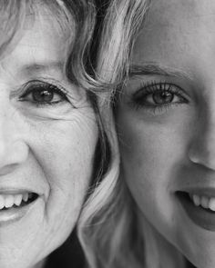 two women are smiling for the camera with their eyes wide open and one woman has her hair pulled back