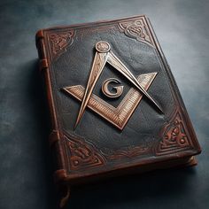 an old book with a masonic symbol on it