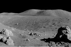 the surface of the moon with rocks and mountains in the background, as seen by nasa's opportunity rover