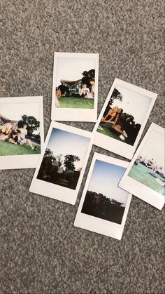 five polaroid photos are laying on the ground