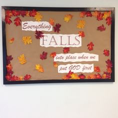 a bulletin board with fall leaves and writing on it that says everything falls into place when we just go first