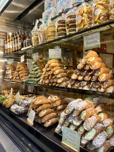 a display case filled with lots of different kinds of pastries