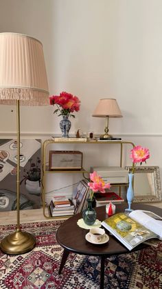 a living room filled with furniture and flowers