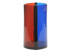 a blue, red and black vase sitting on top of a table