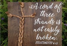 a wooden sign with a rope on it that says, a cord of three strands is not easily broken