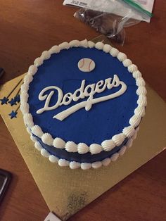 a dodgers cake sitting on top of a wooden table