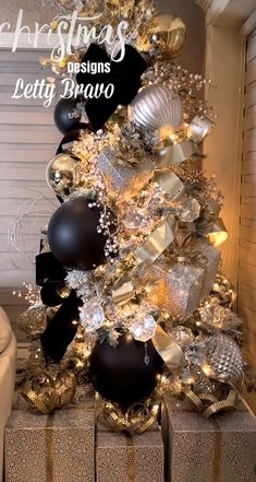 a christmas tree decorated with black and gold ornaments