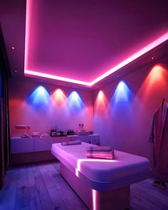 a room that has some lights on the ceiling and in front of it is a bed