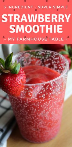 strawberry smoothie in a glass with strawberries on the side and text overlay reading 3 ingredient super simple strawberry smoothie my farmhouse table