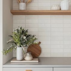 the kitchen counter is clean and ready to be used as a shelf for cooking utensils