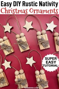 wooden stars and ornaments hang from twine on a red wall, with string attached to them