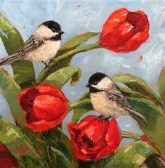 two birds sitting on top of red flowers