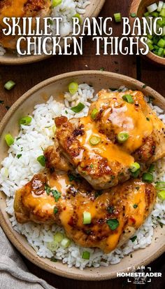 two plates filled with chicken and rice on top of a wooden table in front of the words skillet bang bang chicken thighs