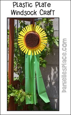 a green ribbon with a sunflower on it and the words plastic plate windsor craft