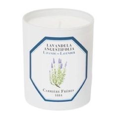 a white candle with lavender on it