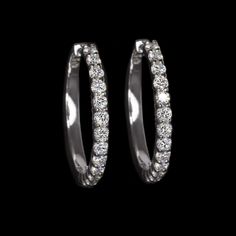 These stunning lab grown diamond hoops have a classic design and vibrant, lively sparkle! Set with 1.63 carats of lively lab grown diamonds, these earrings display eye catching sparkle, and a striking look! These classic earrings are impressive and elegant enough for a special occasion, but simple enough for everyday wear.The diamonds are bright white and exceptionally clean, graded D-F VVS-VS. They are all excellent cut for fantastic sparkle! The diamonds are all lab grown, offering all the bea Diamond White Hoop Earrings, Diamond White Round Cut Diamond Hoop Earrings, Diamond White Brilliant Cut Hoop Earrings, Diamond White Hoop Diamond Earrings, Single Piece, Luxury Platinum Hoop Earrings With Single-cut Diamonds, Sparkling Lights, Classic Earrings, Earring Display, Diamond Hoop Earrings