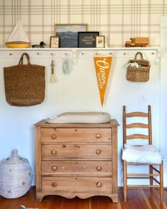 a baby crib and dresser in a room